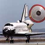 Space shuttle touching down safely