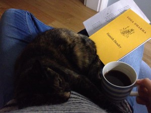 Hannah with cat, coffee & chanting