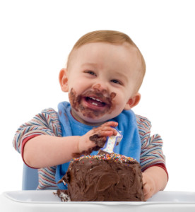 happy-baby-eating-a-chocolate-cake